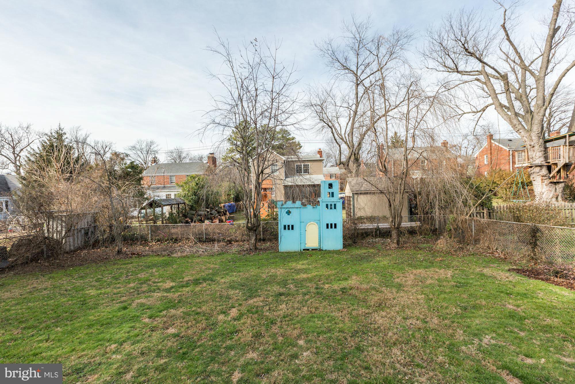 10002 Rogart Road Silver Spring, MD 20901 - Photo 27 of 28 a view of a house with a yard