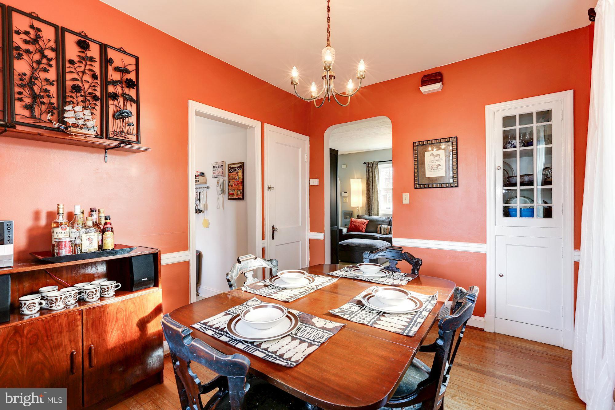 10002 Rogart Road Silver Spring, MD 20901 - Photo 6 of 28 a view of a dining room with furniture and wooden floor
