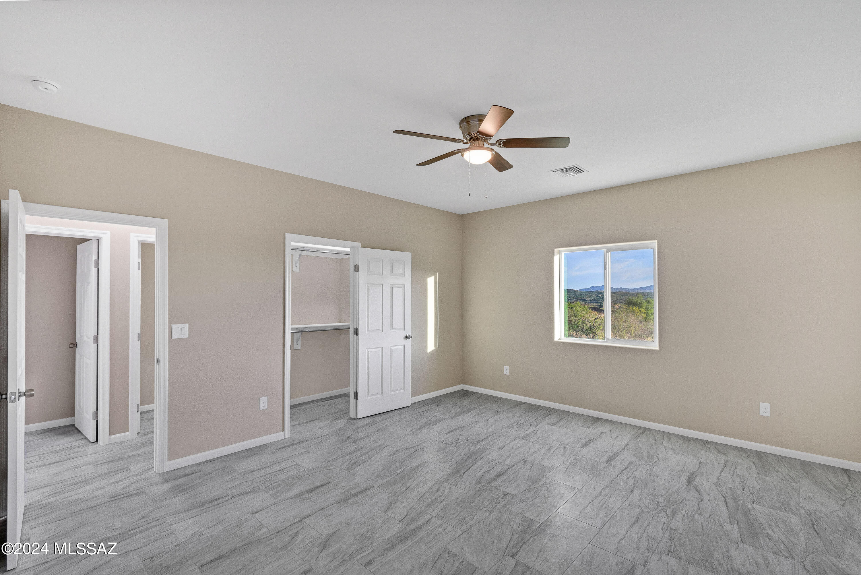 356 Globo Court Rio Rico, AZ 85648 - Photo 16 of 32 a view of empty room with wooden floor