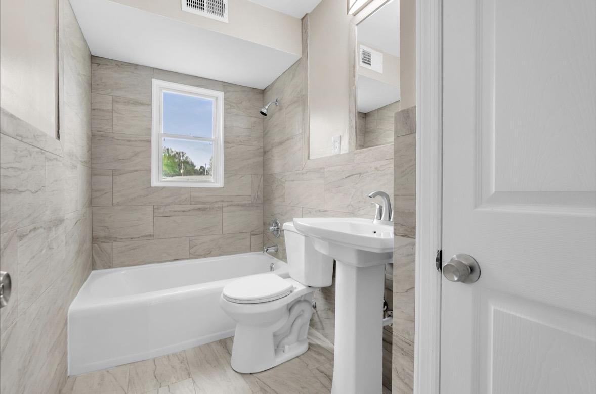 1649 Babs Road Memphis, TN 38116 - Photo 13 of 20 a bathroom with a sink toilet and shower