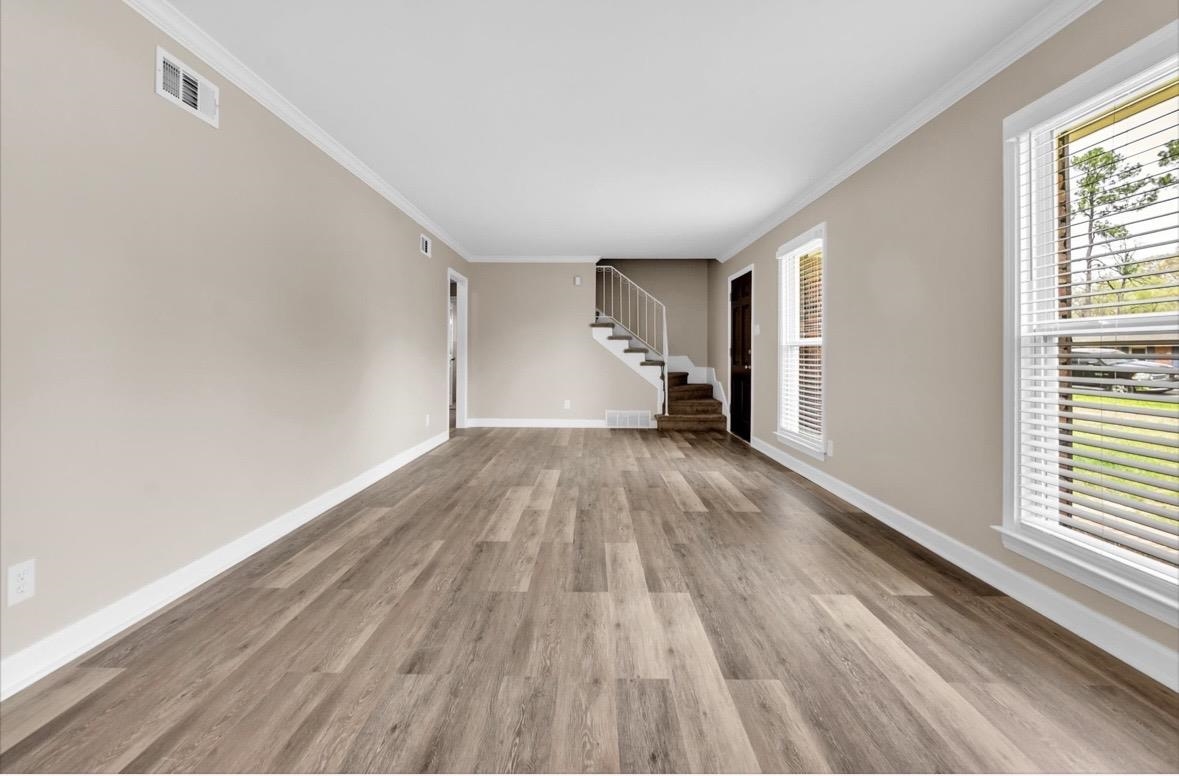 1649 Babs Road Memphis, TN 38116 - Photo 17 of 20 a view of empty room with wooden floor and fan