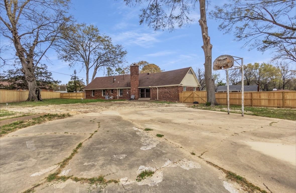 1649 Babs Road Memphis, TN 38116 - Photo 19 of 20 a view of a yard with wooden fence
