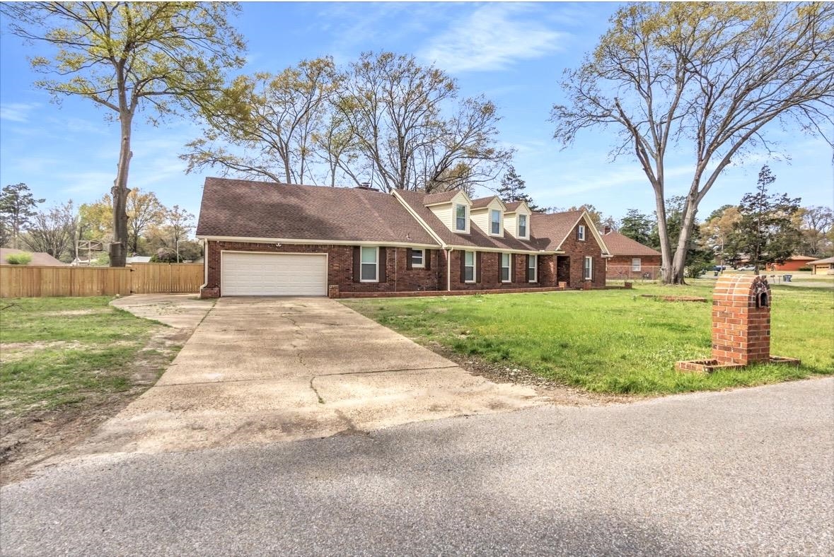 1649 Babs Road Memphis, TN 38116 - Photo 2 of 20 a house with trees in the background