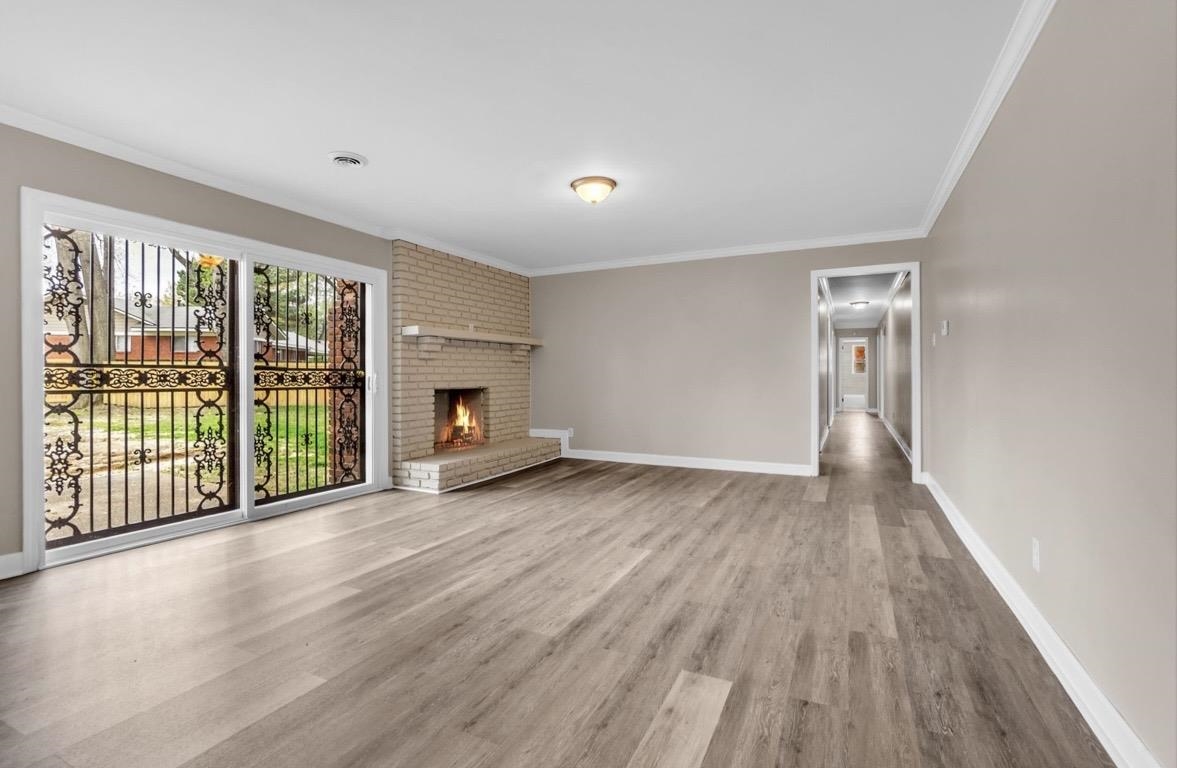 1649 Babs Road Memphis, TN 38116 - Photo 8 of 20 wooden floor fireplace and natural light in room