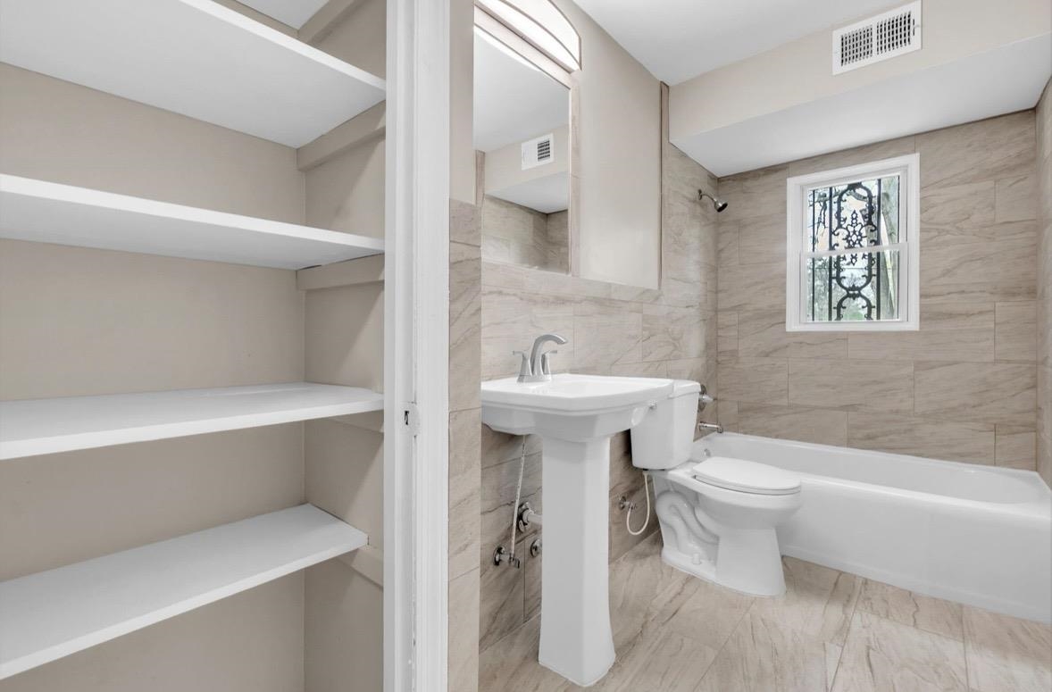 1649 Babs Road Memphis, TN 38116 - Photo 10 of 20 a bathroom with a sink toilet and shower