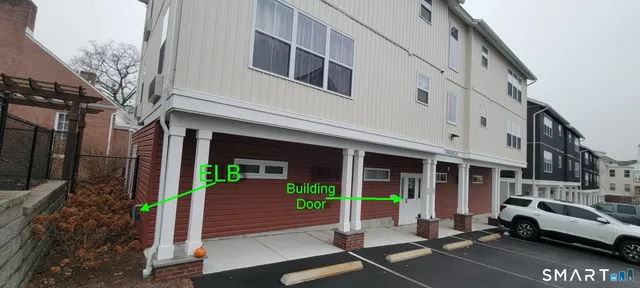 a view of a building with car parked