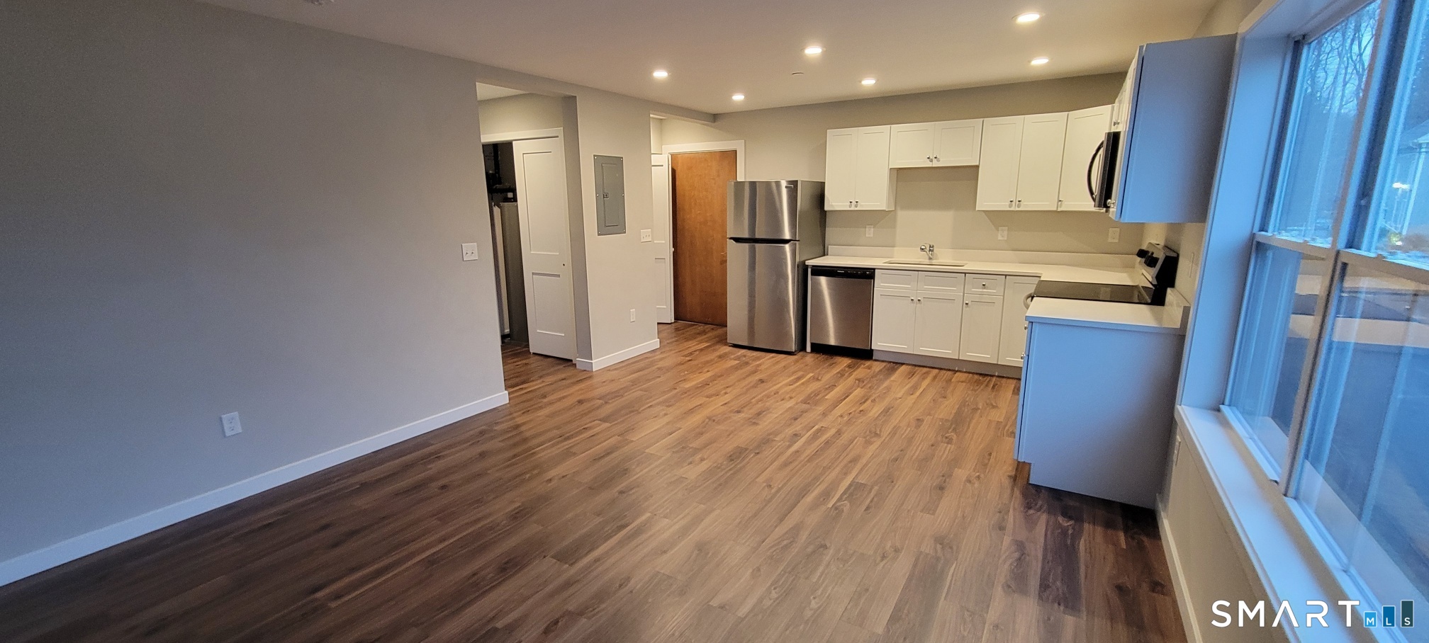 155 Greenwood Avenue, Unit B202 Bethel, CT 06801 - Photo 8 of 14 Living room open to kitchen