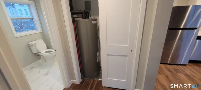 a view of bathroom with a sink and mirror