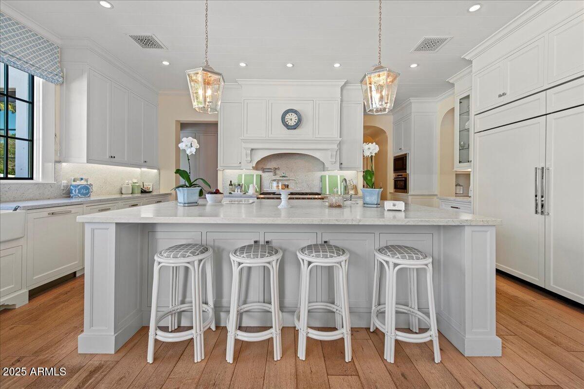 5446 East Exeter Boulevard Phoenix, AZ 85018 - Photo 18 of 59 a kitchen with granite countertop a table chairs stove a sink and dishwasher
