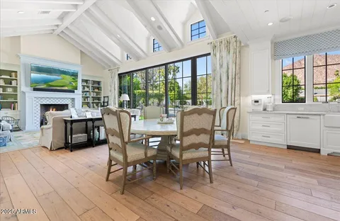 a kitchen with stainless steel appliances a sink stove and cabinets