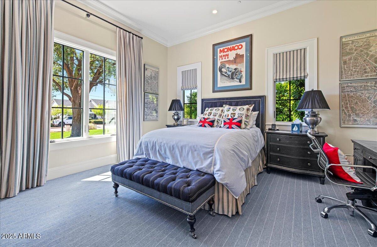 5446 East Exeter Boulevard Phoenix, AZ 85018 - Photo 27 of 59 a bedroom with a bed painting on wall and windows