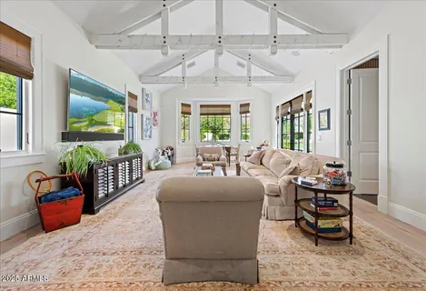 a bedroom with a large bed and a window