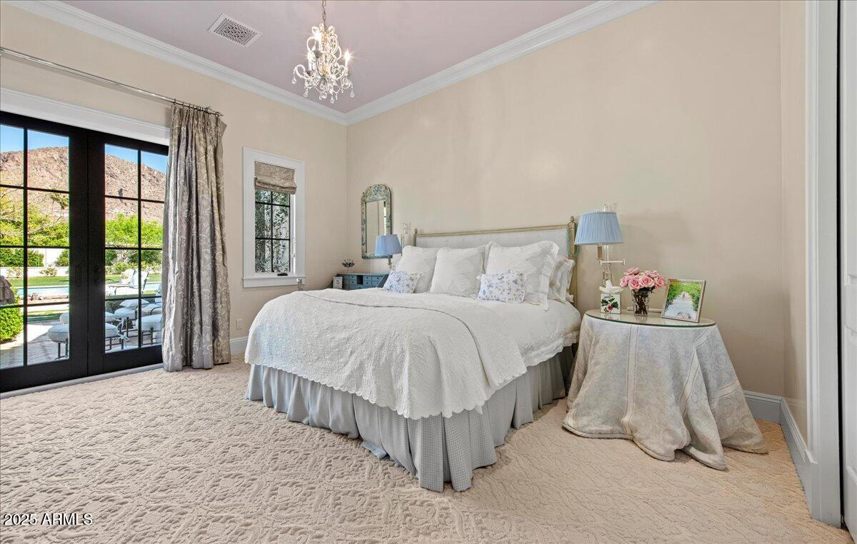 5446 East Exeter Boulevard Phoenix, AZ 85018 - Photo 31 of 59 a spacious bedroom with a bed and a large window