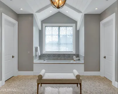 a front view of a house with swimming pool having outdoor seating