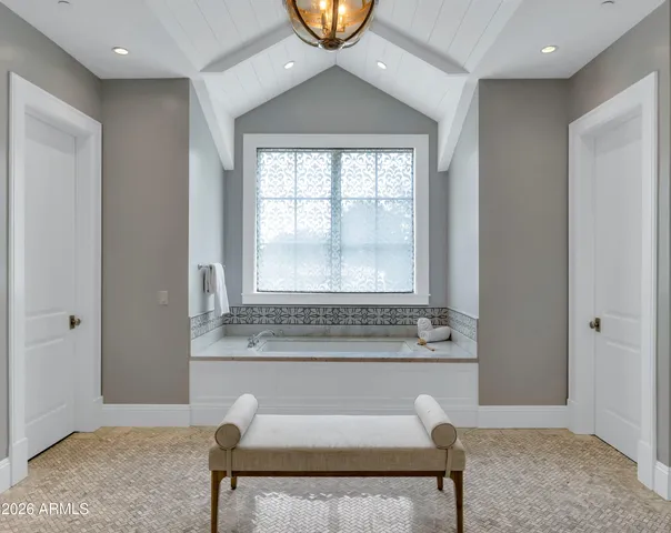 a front view of a house with swimming pool having outdoor seating