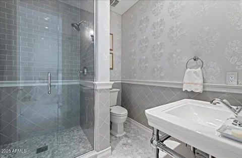 a living room with furniture gym equipment and a large window