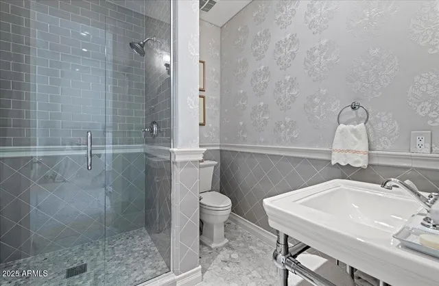 a living room with furniture gym equipment and a large window