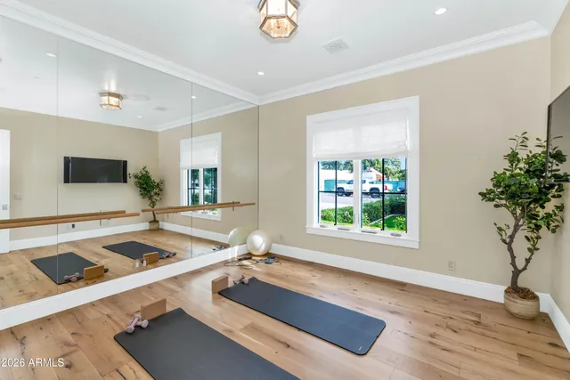 a view of a patio with couches table and chairs and potted plants