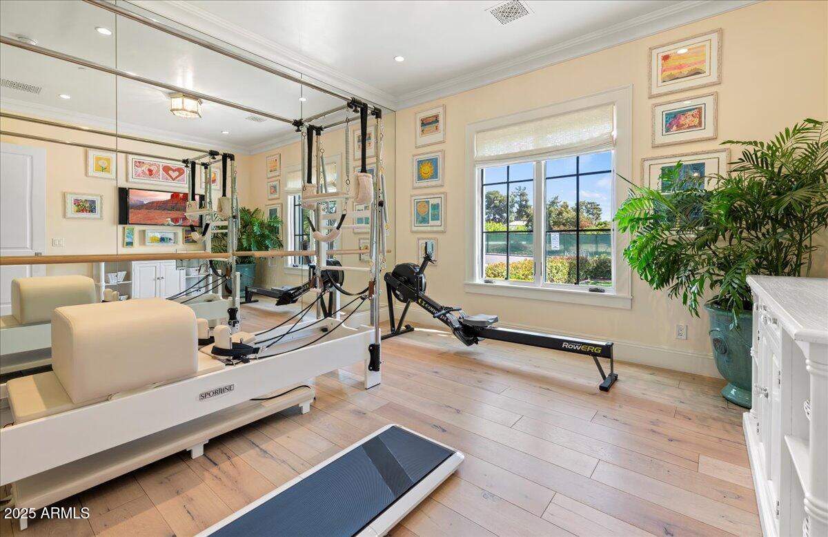 5446 East Exeter Boulevard Phoenix, AZ 85018 - Photo 37 of 59 a living room with furniture gym equipment and a large window