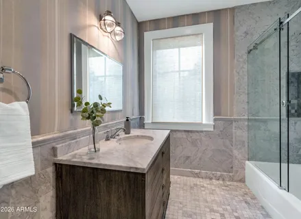 a front view of a house with a yard and pathway