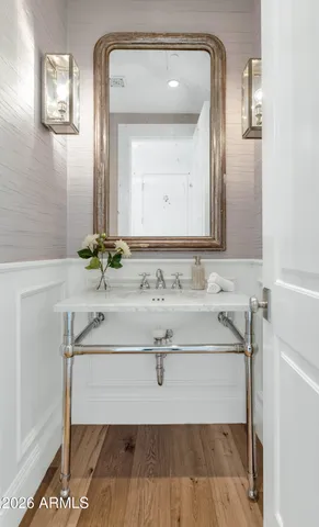 a front view of a house with a garden and plants