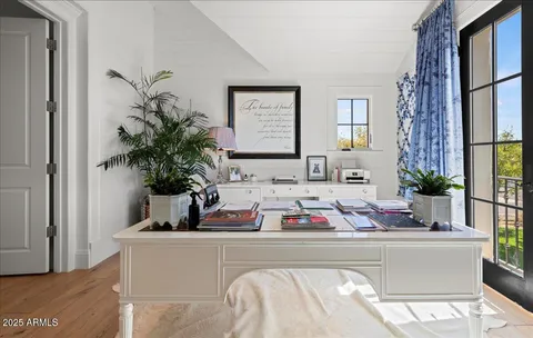 a spacious bathroom with a double vanity sink a mirror and a shower