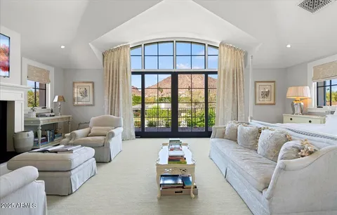 a spacious bathroom with double sink and a mirror