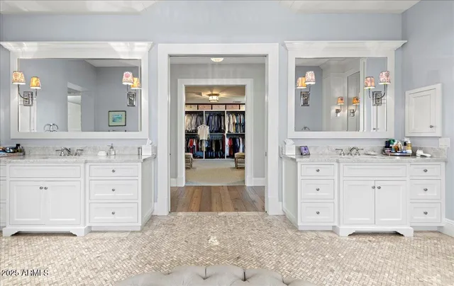 a kitchen with a sink a washer and dryer next to a window