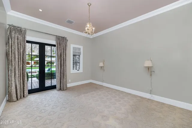 a view of a patio with table and chairs and potted plants