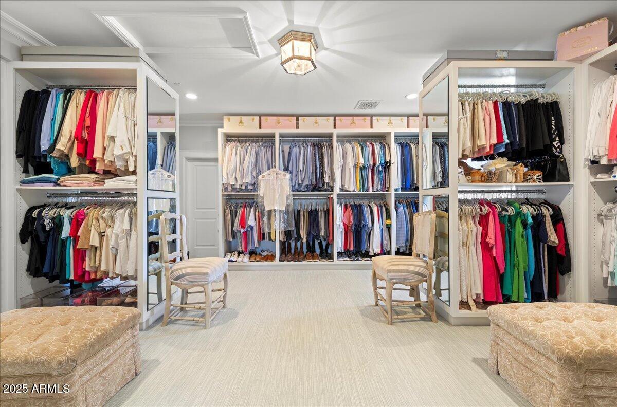 5446 East Exeter Boulevard Phoenix, AZ 85018 - Photo 46 of 59 a view of walk in closet with clothes and shoes