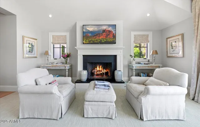 a view of house with a big yard and large trees