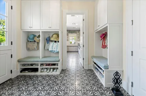 a front view of a house with a garden and yard