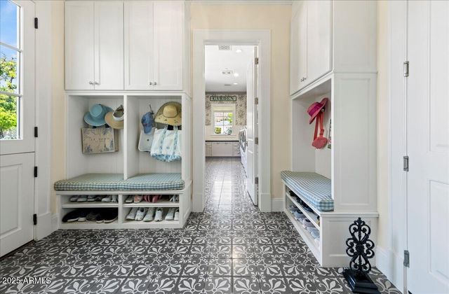 a front view of a house with a garden and yard