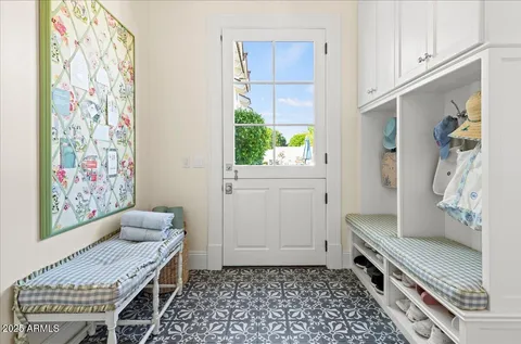a view of a house with swimming pool and sitting area