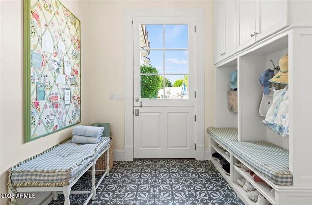 a view of a house with swimming pool and sitting area