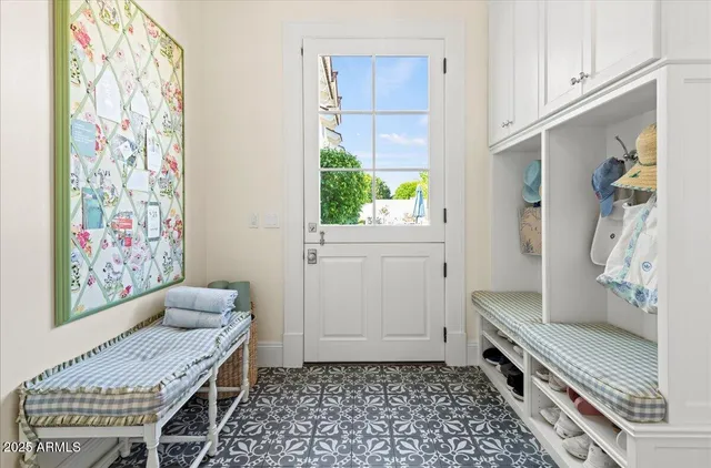 a view of a house with swimming pool and sitting area