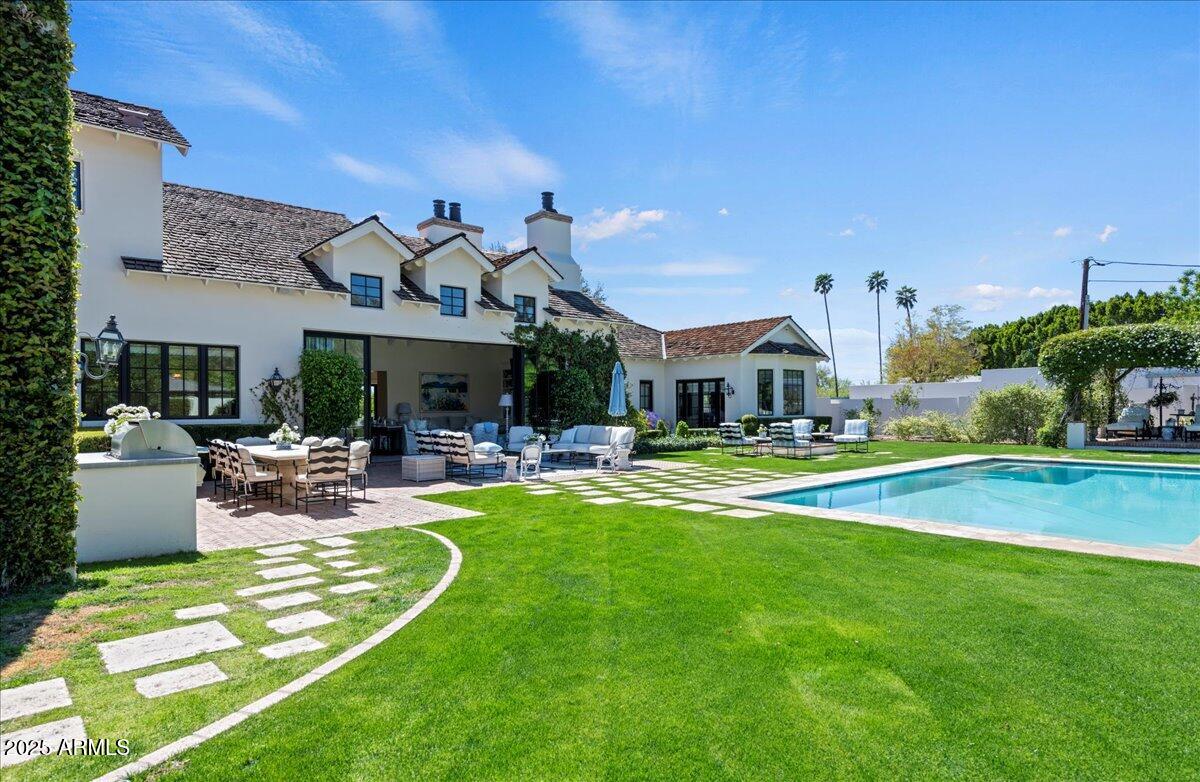 5446 East Exeter Boulevard Phoenix, AZ 85018 - Photo 56 of 59 a view of a house with swimming pool and sitting area