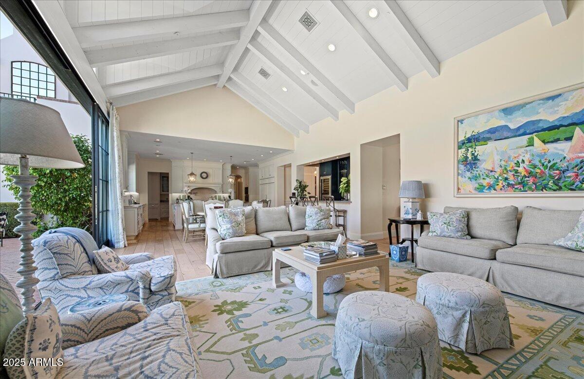 5446 East Exeter Boulevard Phoenix, AZ 85018 - Photo 8 of 59 a living room with furniture fireplace and a large window