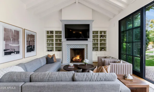 a kitchen with a dining table chairs cabinets and stainless steel appliances