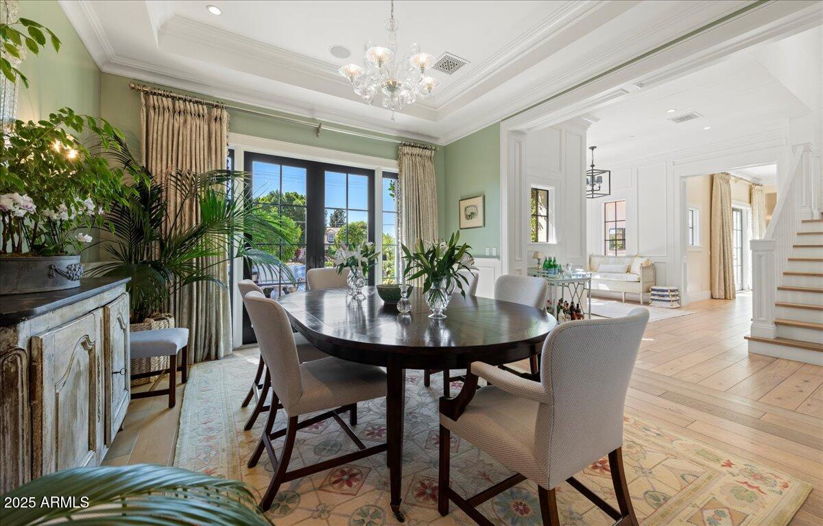5446 East Exeter Boulevard Phoenix, AZ 85018 - Photo 9 of 59 a view of a dining room with furniture window and wooden floor