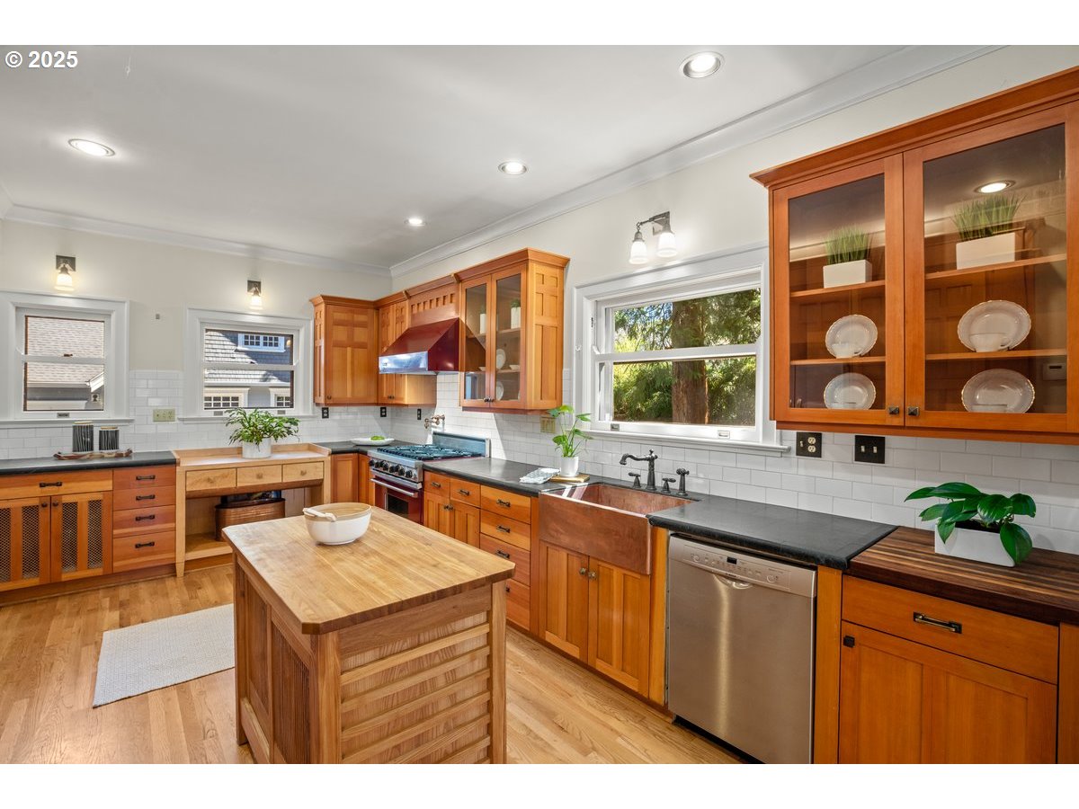1314 Southeast 55th Avenue Portland, OR 97215 - Photo 23 of 47 a kitchen with stainless steel appliances a sink stove and cabinets