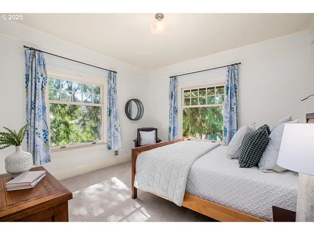 a bedroom with a bed and a chair