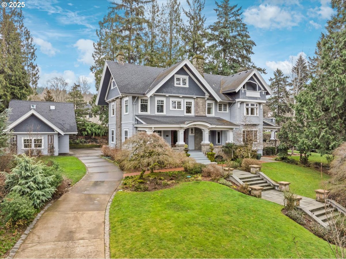 1314 Southeast 55th Avenue Portland, OR 97215 - Photo 3 of 47 a front view of a house with a garden and trees