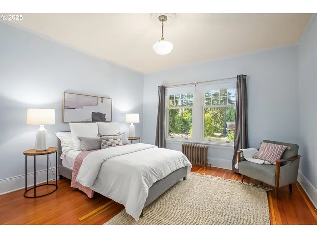 a bedroom with furniture and a window