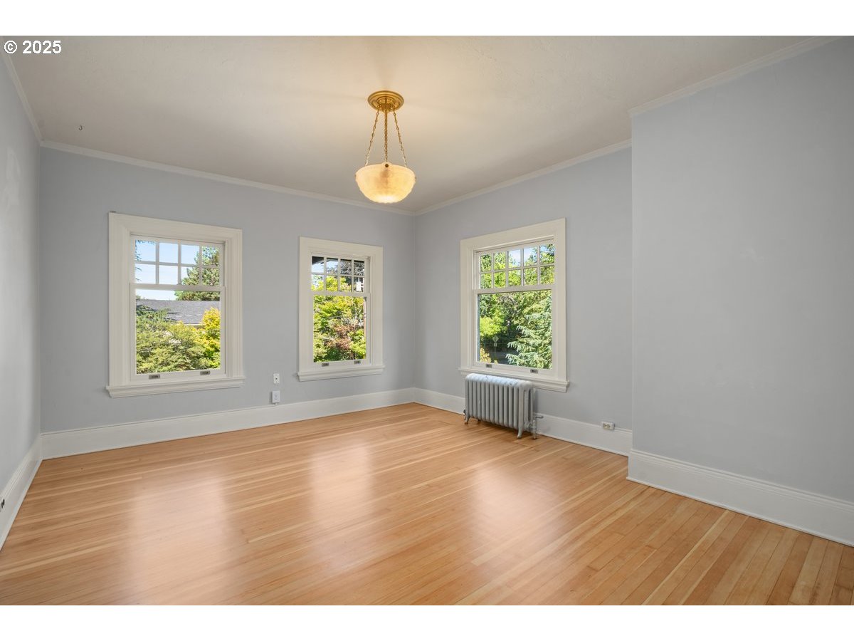 1314 Southeast 55th Avenue Portland, OR 97215 - Photo 33 of 47 an empty room with wooden floor and windows