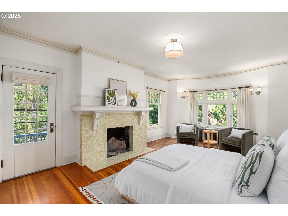 1314 Southeast 55th Avenue Portland, OR 97215 - Photo 34 of 47 a bedroom with a bed and a chandelier
