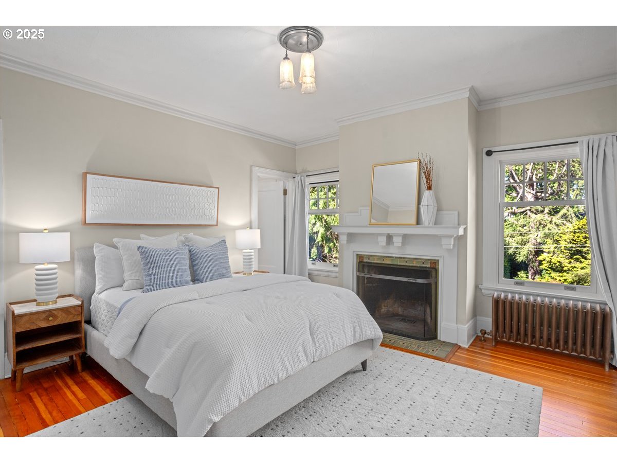 1314 Southeast 55th Avenue Portland, OR 97215 - Photo 37 of 47 a bedroom with a bed and a fireplace