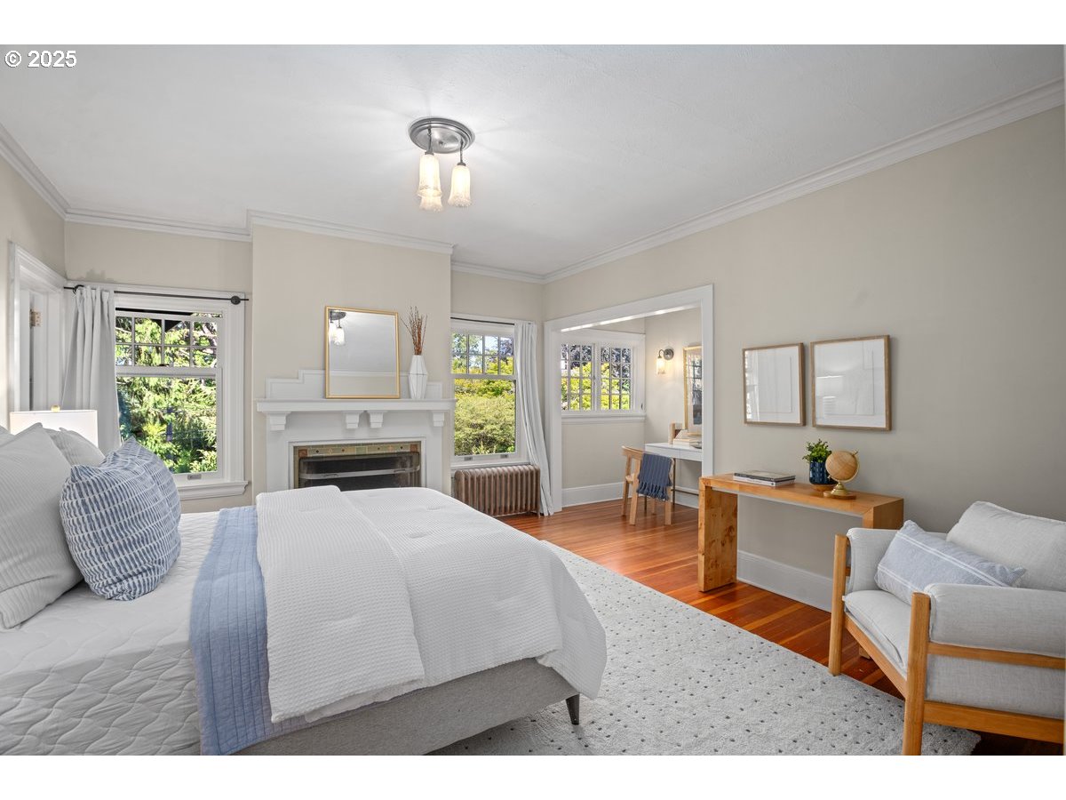 1314 Southeast 55th Avenue Portland, OR 97215 - Photo 38 of 47 a living room with furniture a dining table and a fireplace