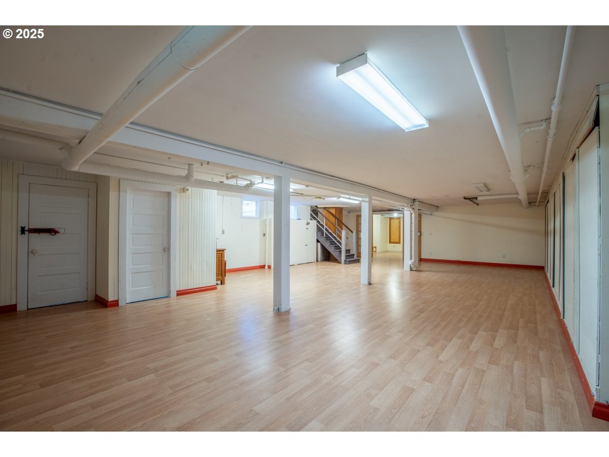 1314 Southeast 55th Avenue Portland, OR 97215 - Photo 42 of 47 a view of an empty room with wooden floor