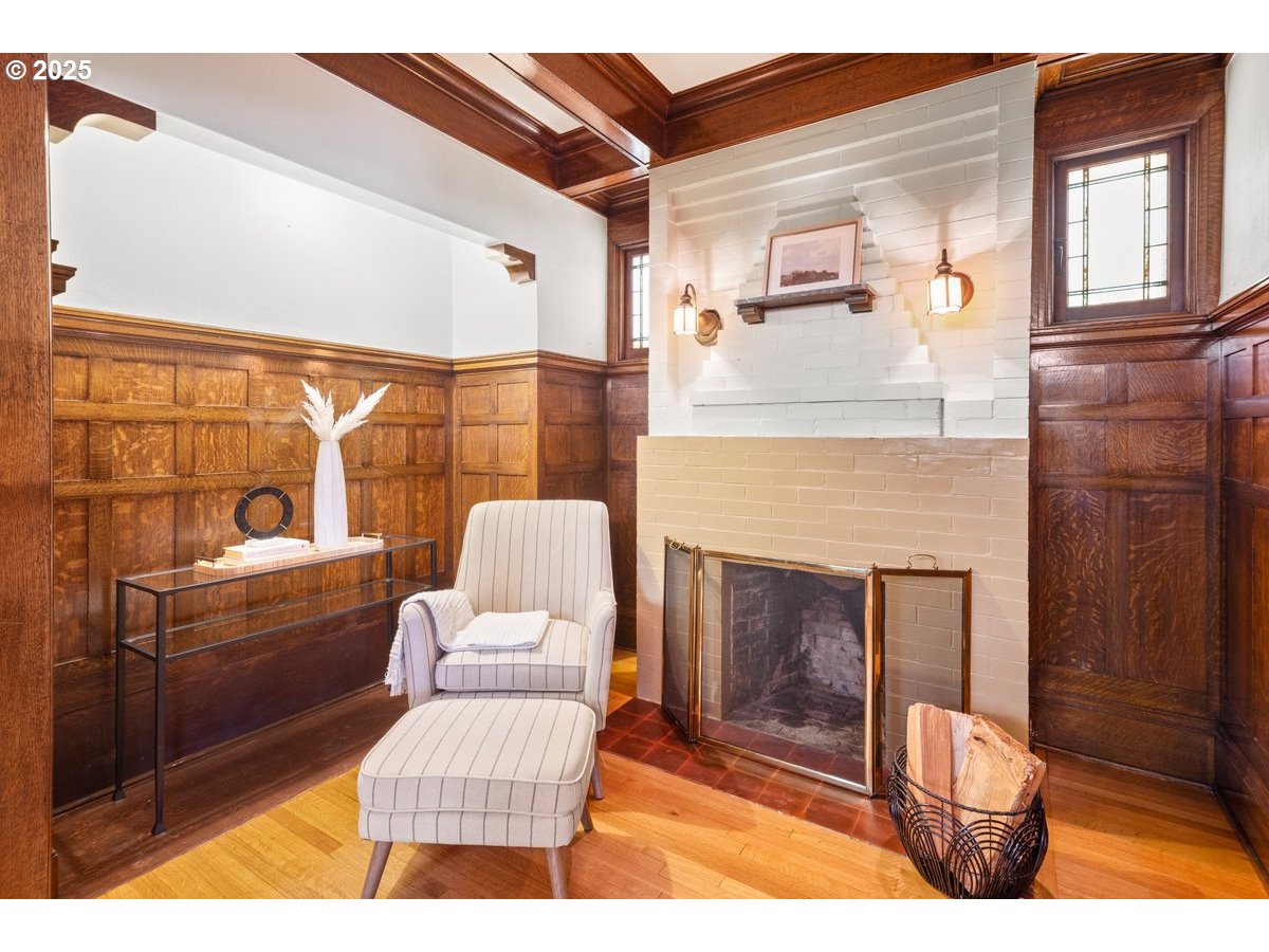 1314 Southeast 55th Avenue Portland, OR 97215 - Photo 9 of 47 a living room with furniture a fireplace and a floor to ceiling window